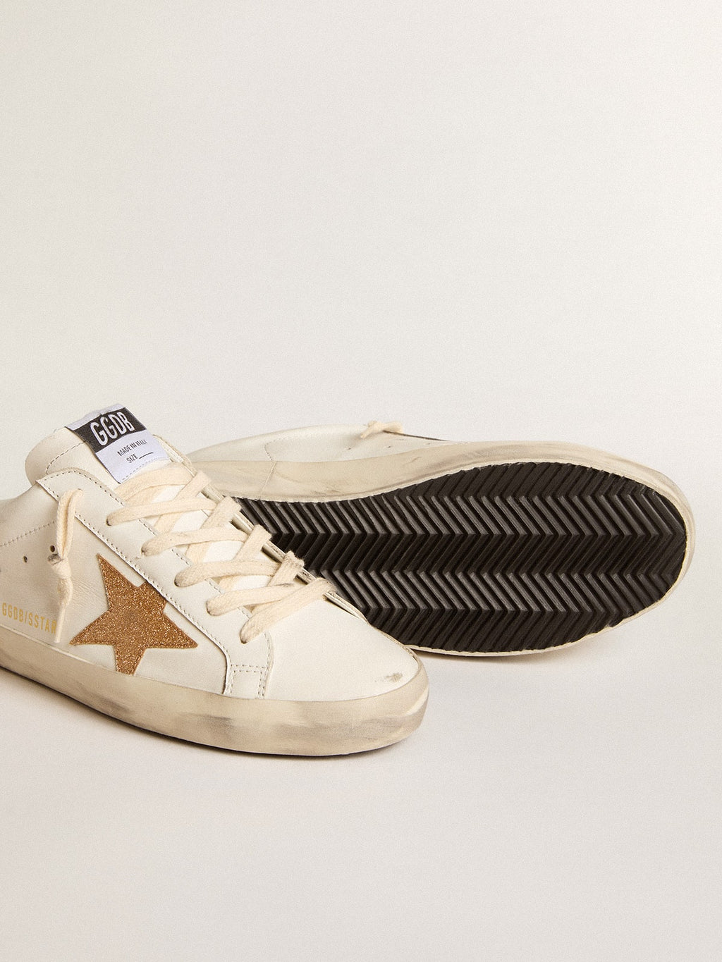 Super-Star Sabots in leather with plasticized gold glitter star