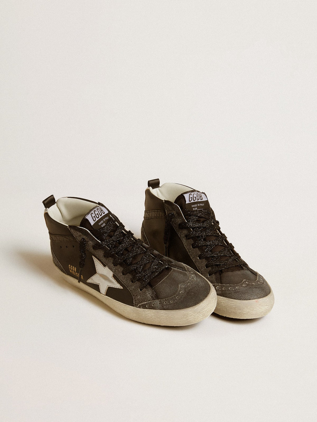 Mid Star da donna in pelle nera con stella in pelle metallizzata argento